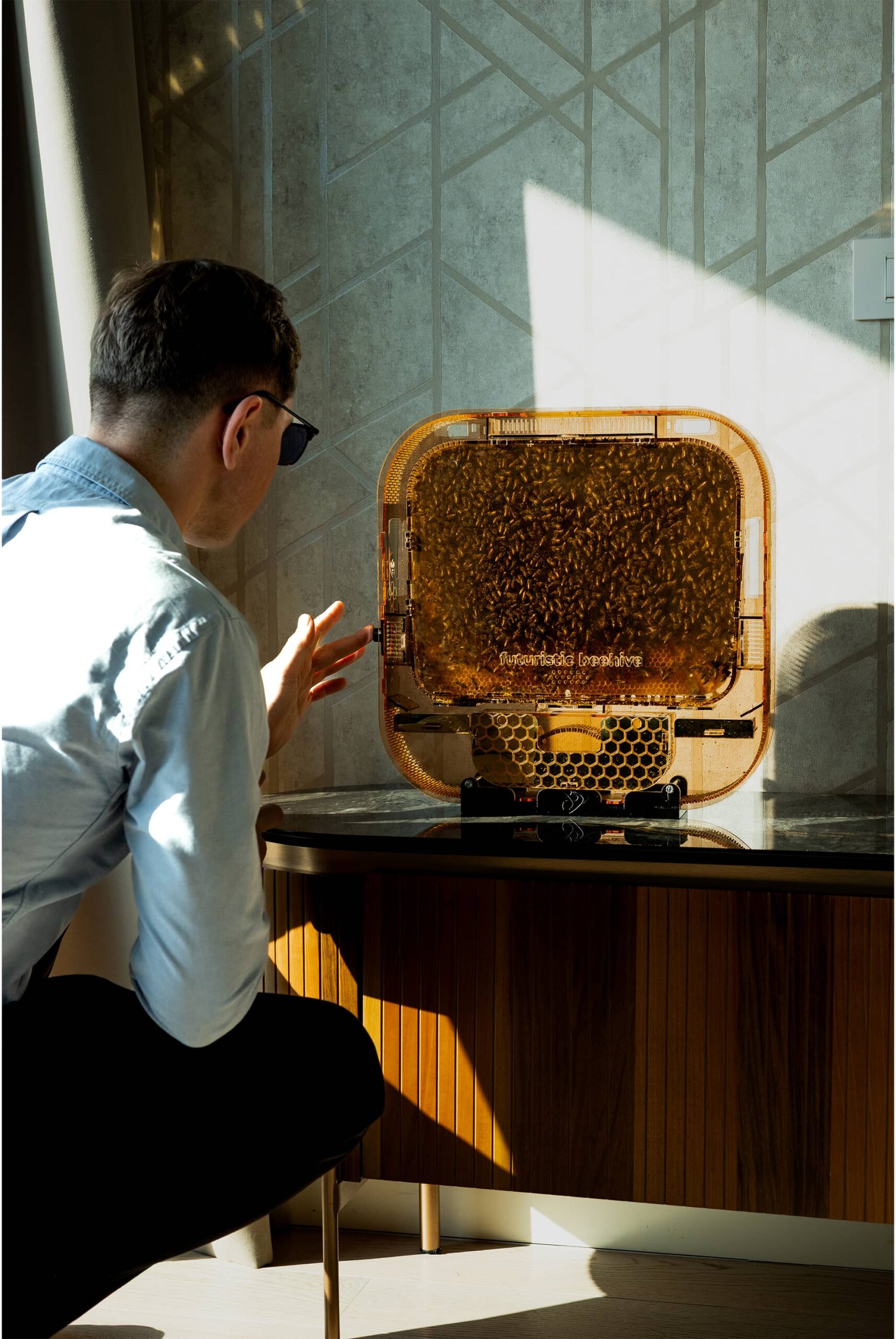 A person watching the colony through the glass of the Symbiotic 3024
